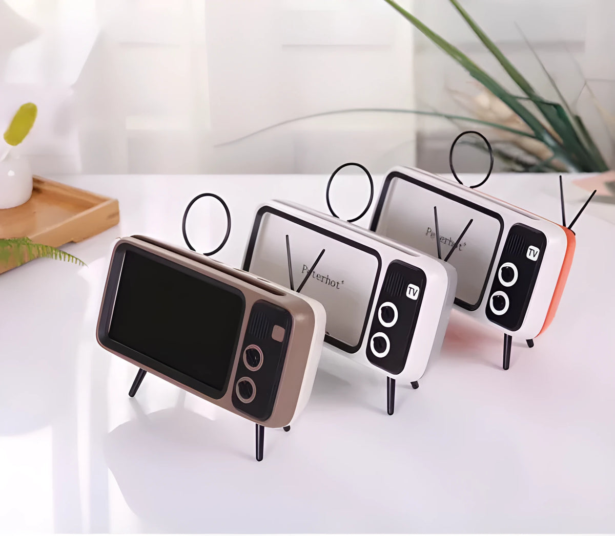 Retro TV mini portable Bluetooth speaker in blue with circular grille and compact 18x8x2.5cm size on a wooden desk