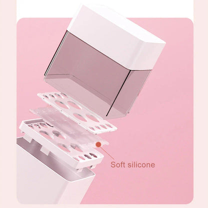 Inverted makeup brush storage bucket in white, blue, and pink for organised dressing tables