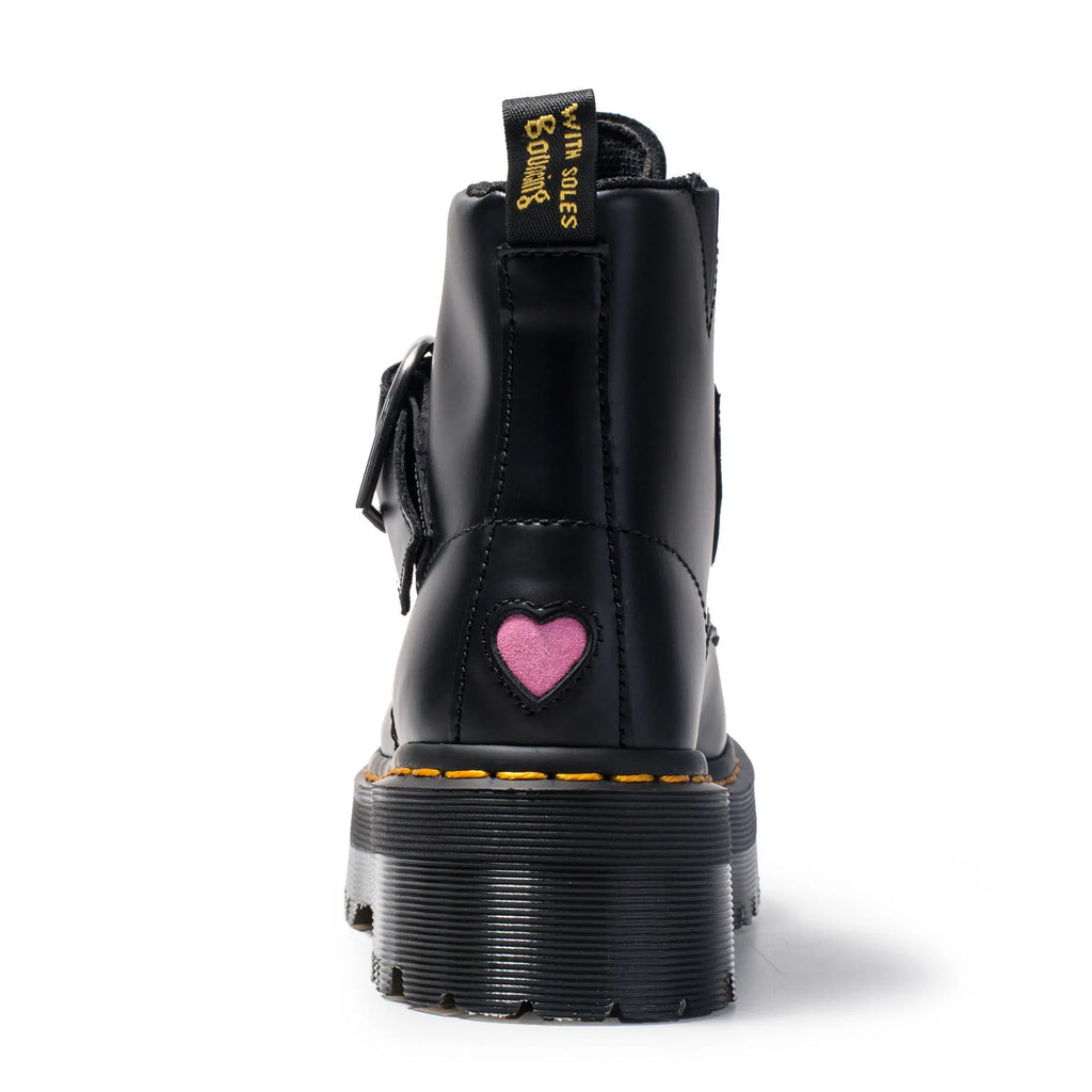 Women's black leather ankle boots with chunky heel, lace-up front, side zip, and belt buckle detail on a waterproof platform