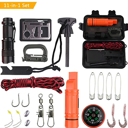 Compact black survival kit with compass, whistle, fishing components, and multi-tool arranged in organised compartments