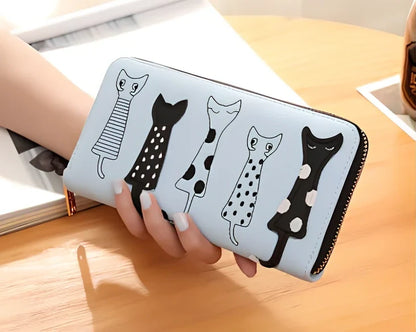 Black women's fashion wallet open showing six card slots and zipped note compartment, 10 cm wide genuine leather