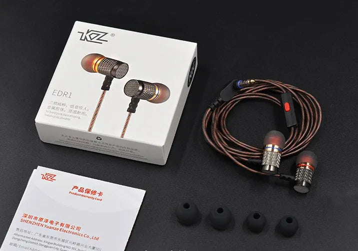 Black wired in-ear headphones with silicone cable, 3.5mm L-bend plug, and TPE ear tips.