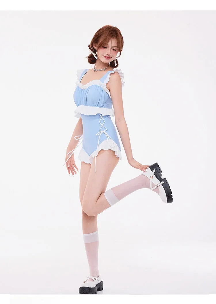 Light blue high-waisted backless one-piece swimsuit with chest gathering detail on a mannequin.