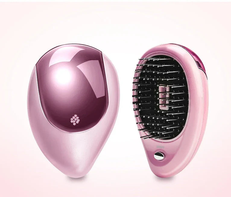 Portable negative ion hair comb with sound wave vibration technology in pink and green