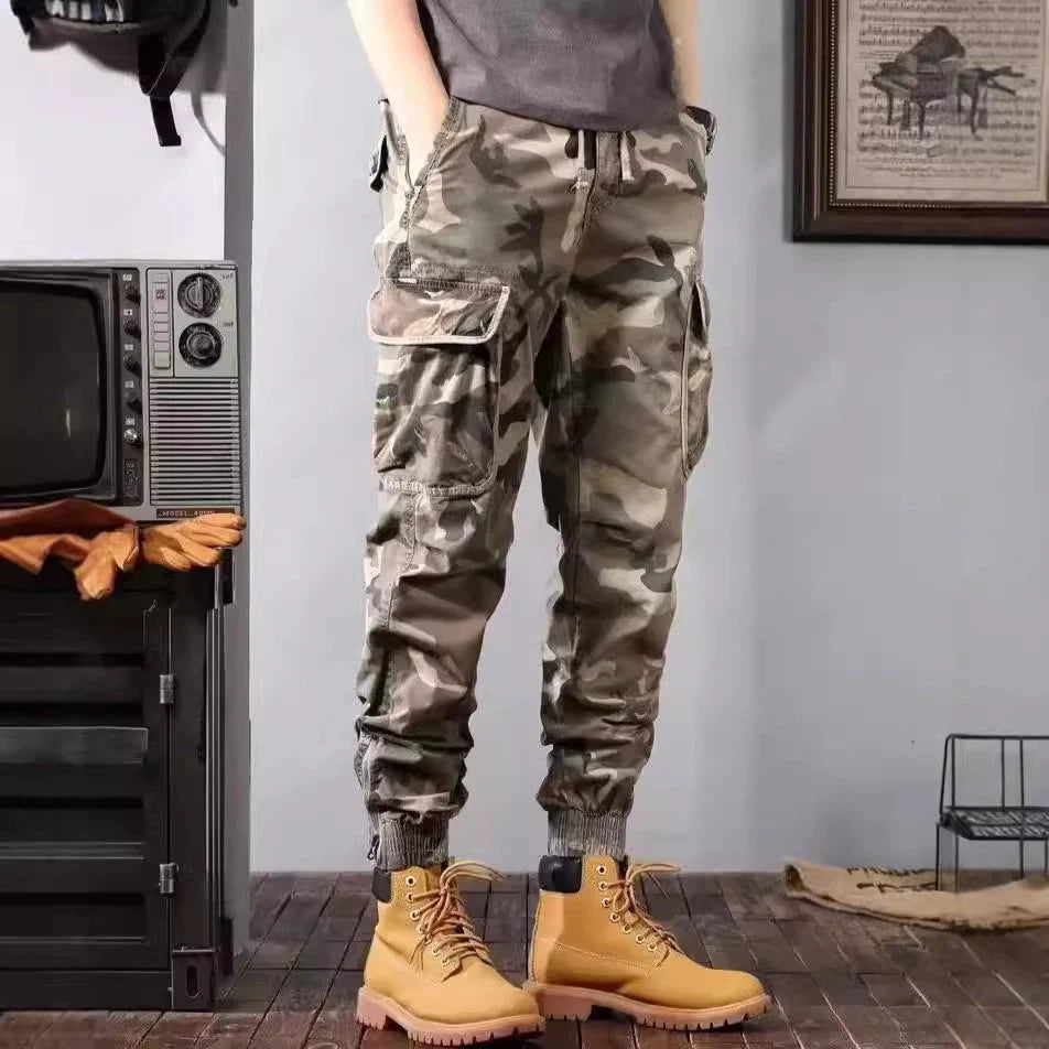 Men's camouflage cargo pants with multiple pockets and loose tapered fit