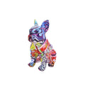 Modern simple French bulldog resin statue in graffiti colour finish on a plain background.