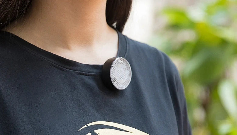 Bicycle LED headlight with clip attachment showing lens reflectors and USB port for charging