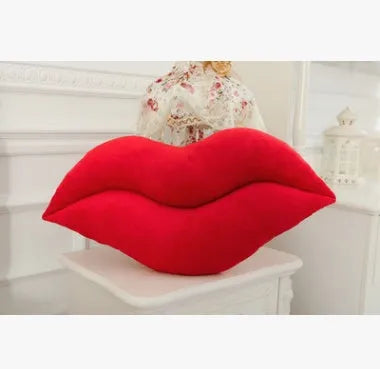 Plush big lips pillow in pink 60 cm tall with short plush fabric on a sofa