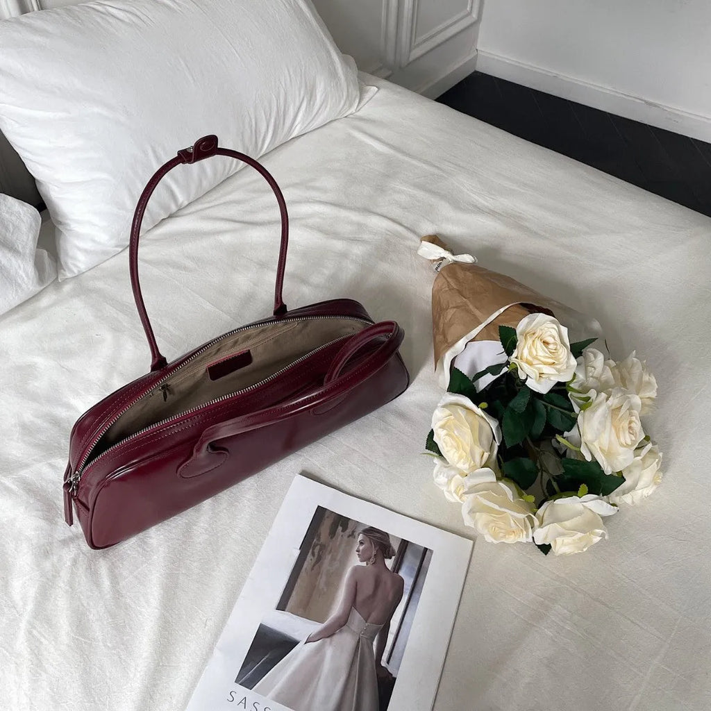 Women's genuine leather first layer cowhide oval single-shoulder bag in Brownie Brown colour with sewing thread detailing