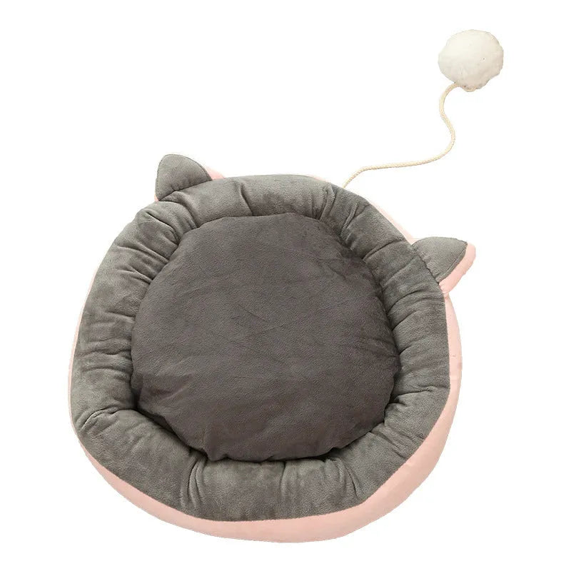 Round suede cat mat in pink grey with cat ear shape, 36cm diameter, on a light floor