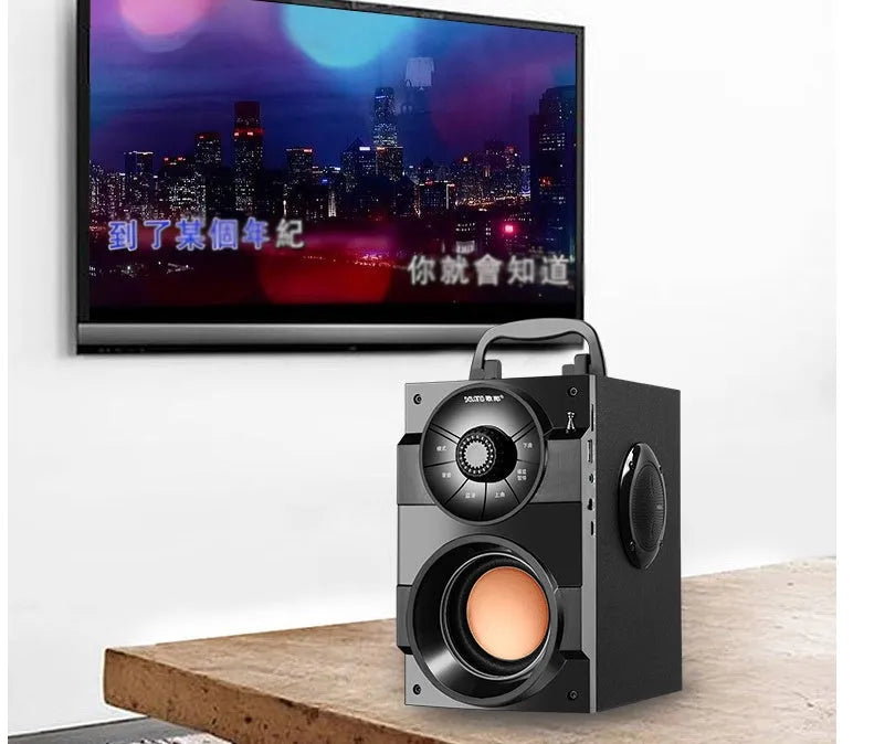 Black portable mini audio system with subwoofer and 3.5mm connection cable