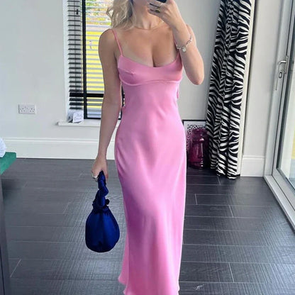 Elegant sleeveless slip maxi dress in pink with backless design and figure-flattering silhouette