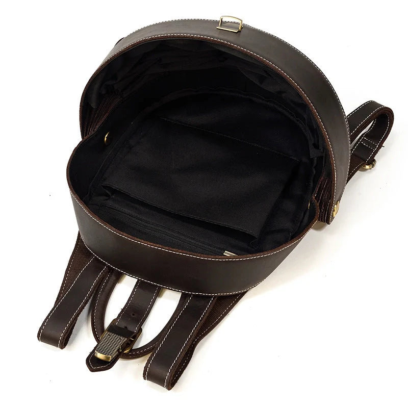 Vintage leather backpack in dark brown and black with multiple pockets