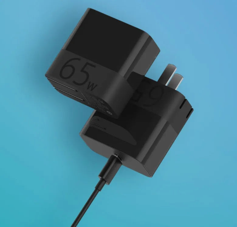 Black ZMI 65W USB-C laptop power adapter with compact design