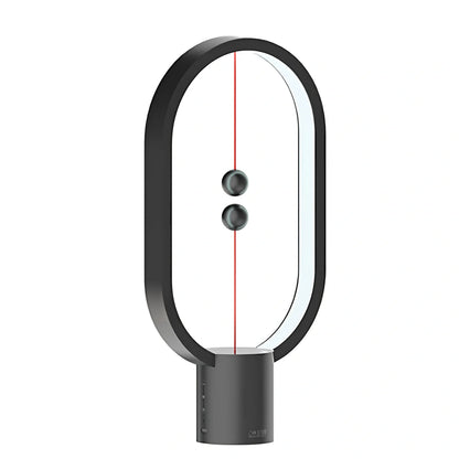 Magnetic bedside night light with ball activation system and adjustable brightness settings