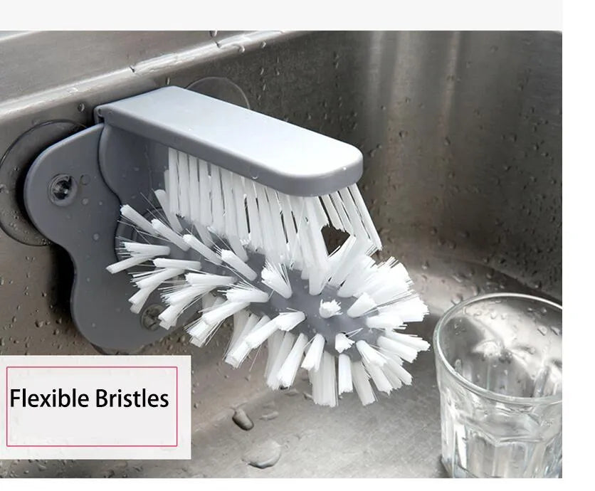 Grey double-headed cup cleaning brush with wall-mounted suction cups for kitchen use