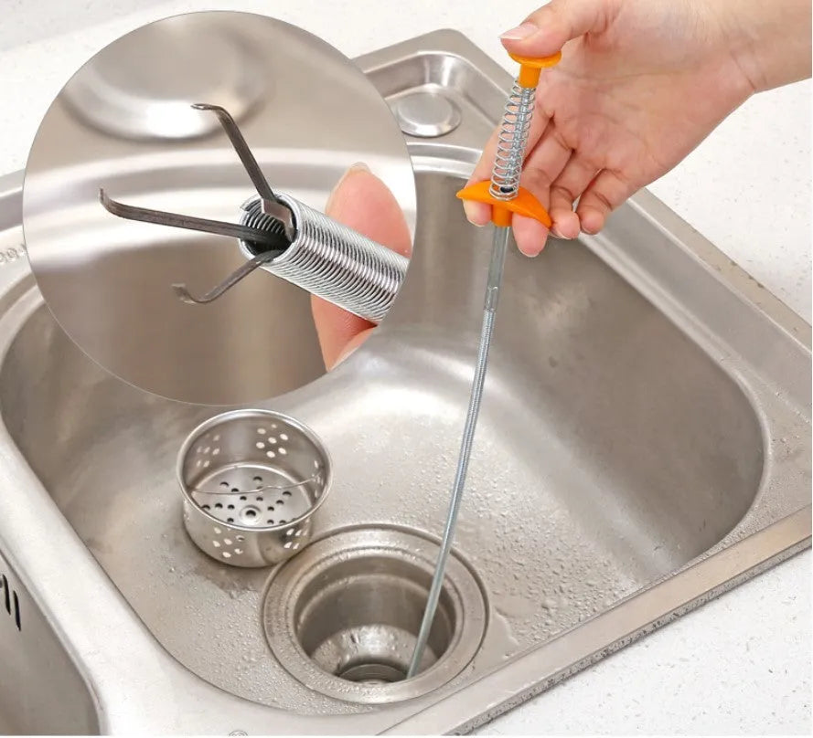 A black sewer dredge spring pipe cleaning tool for unblocking kitchen sink drains