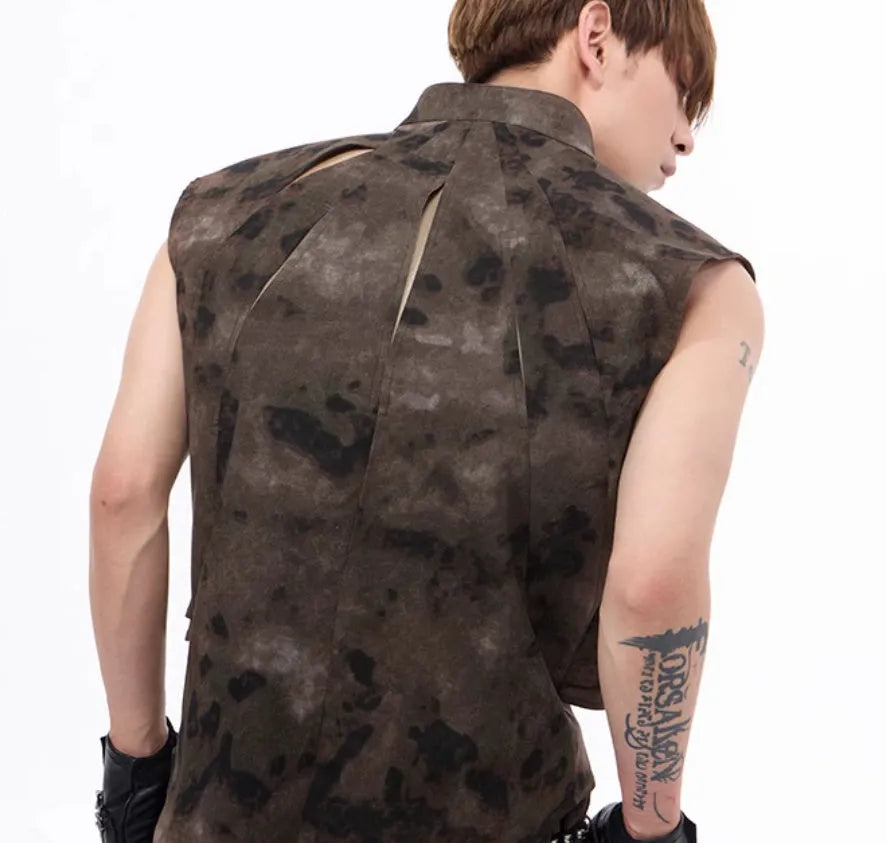 Camouflage pattern denim vest and matching trousers laid flat, showing button front and semi-high collar.
