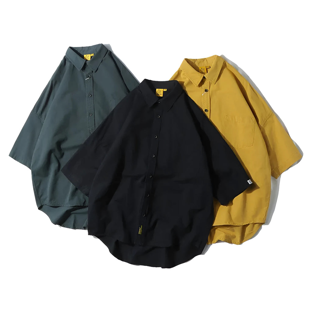 Man wearing a loose-fit yellow Japanese-style cotton shirt with short sleeves.
