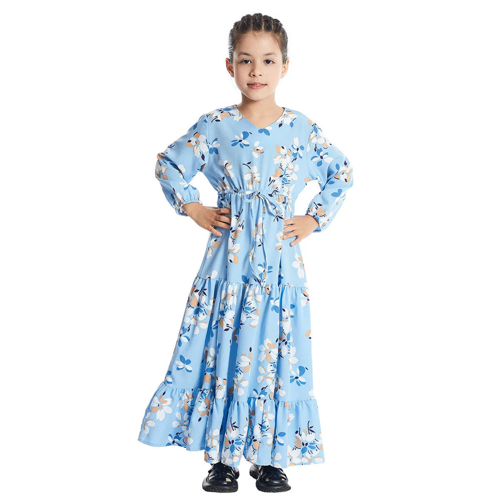Girl wearing a long sleeve floral polyester dress with a flounced skirt in beige, available in heights 100-160cm