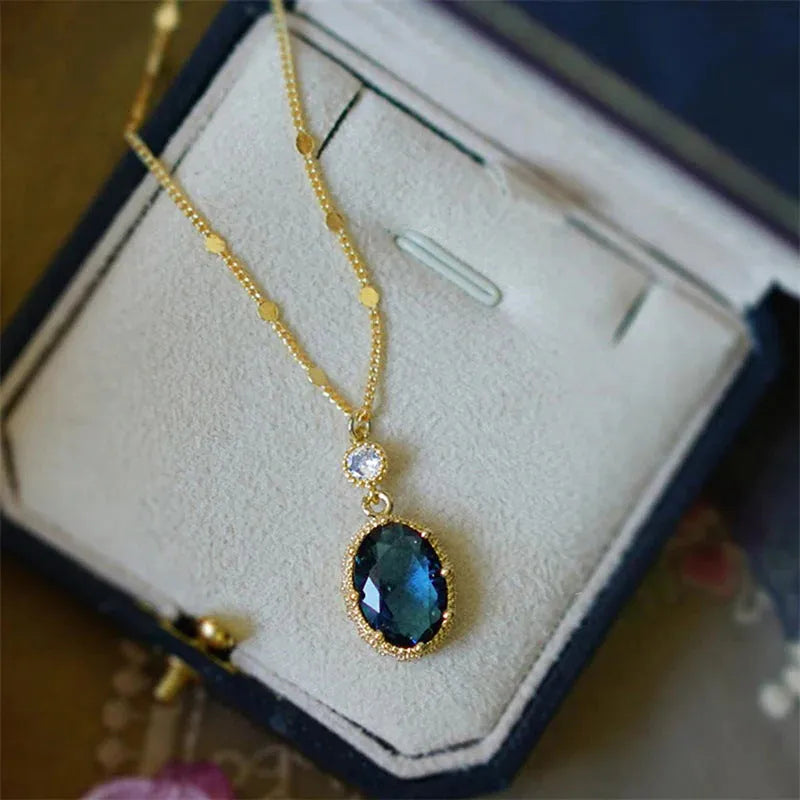 Gold geometric pendant necklace on a chain, French retro style.