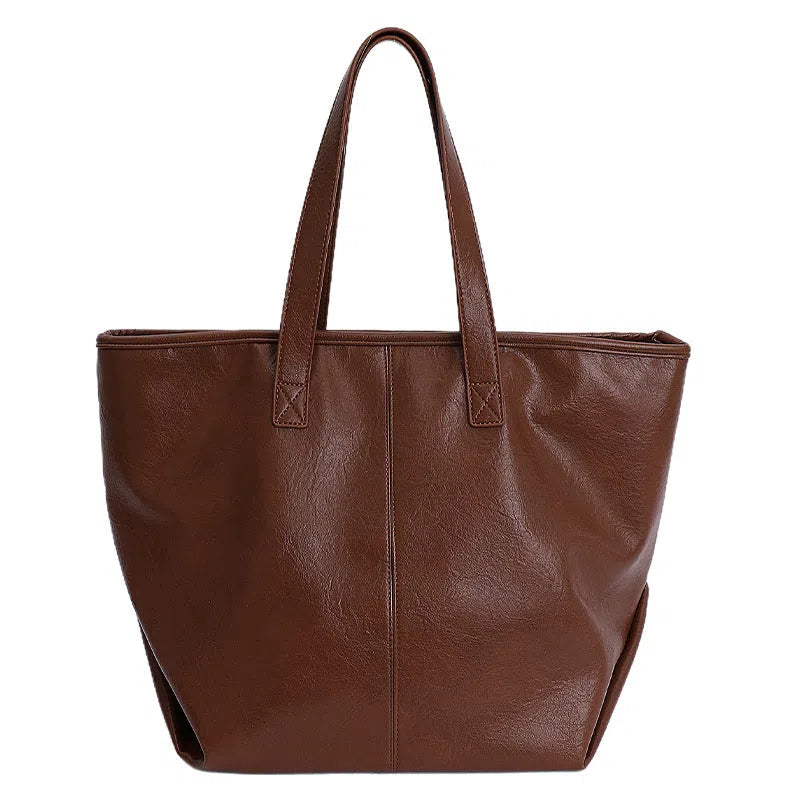 Fashionable large-capacity vintage tote bag in soft PU with stitched seams, horizontal shape, double straps
