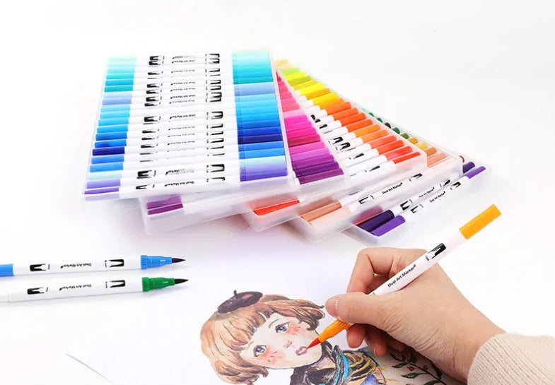 Set of artist watercolour pens with brush tips arranged by colour, showcasing vivid inks.