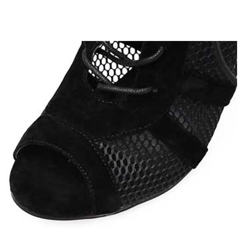 Black suede women's lace-up high heel shoes with a stiletto heel on a plain background
