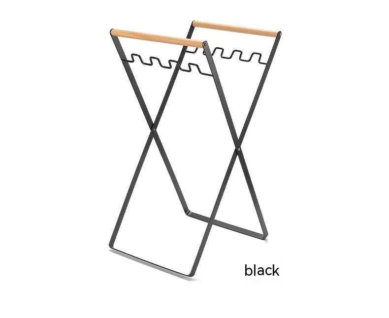 Foldable outdoor garbage storage hanger with iron frame and wooden handle in black colour.