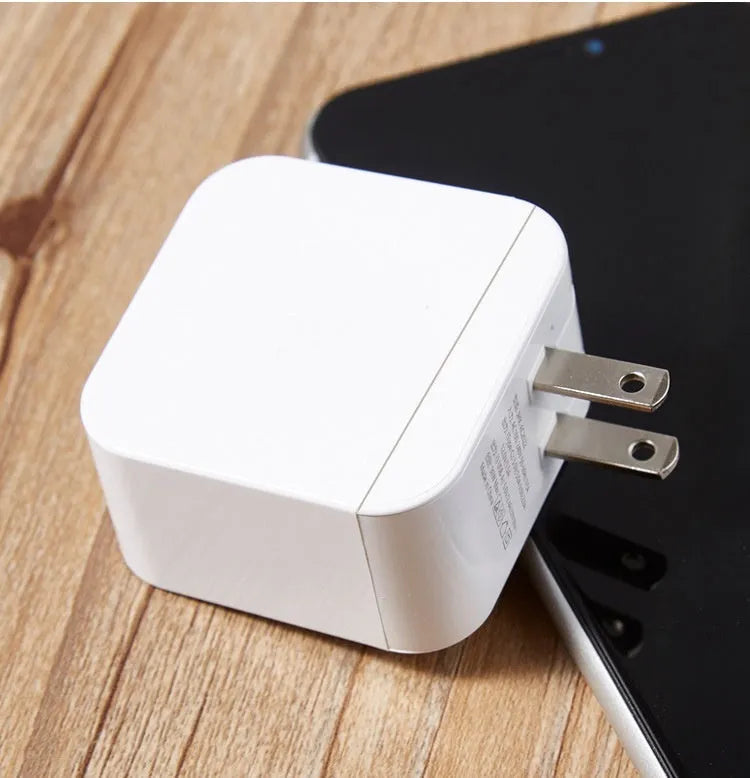 PD20W mobile phone charger in white with USB port on front