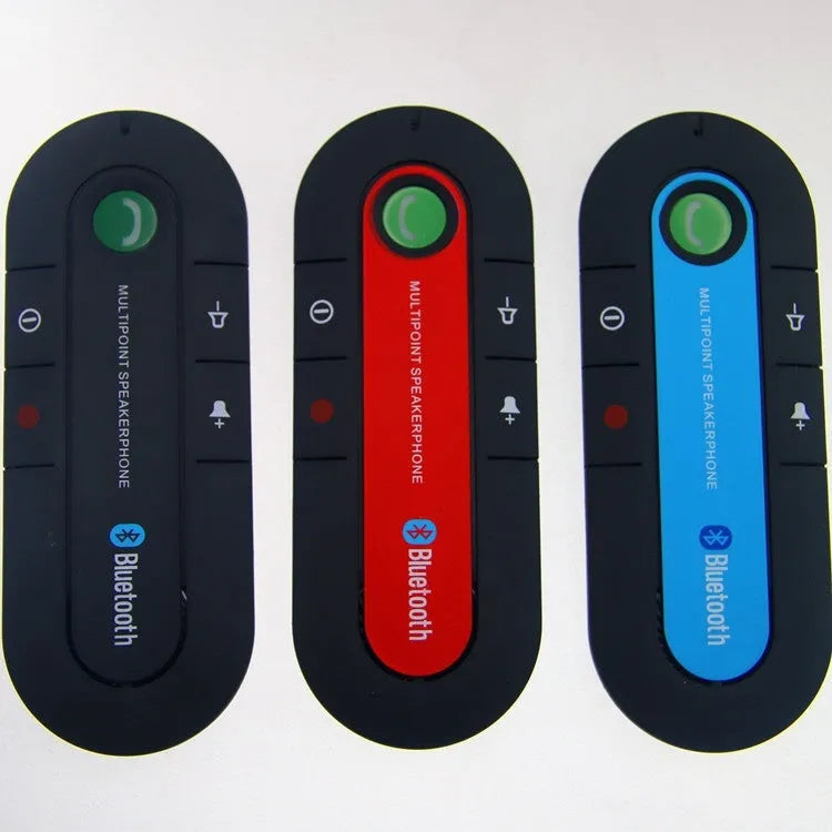 Black vehicle-mounted Bluetooth handsfree device clipped to a car sun visor with power cable.