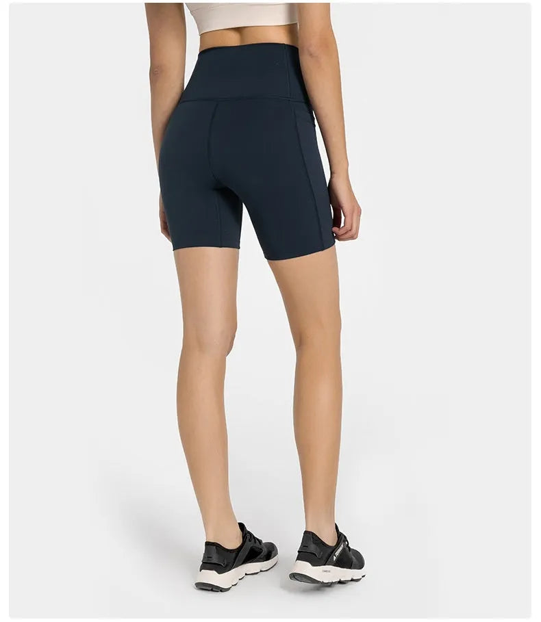 Women's high-waist mid-length sports shorts in black stretch fabric for running and gym