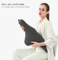 Dark gray memory foam car neck pillow on a car headrest.