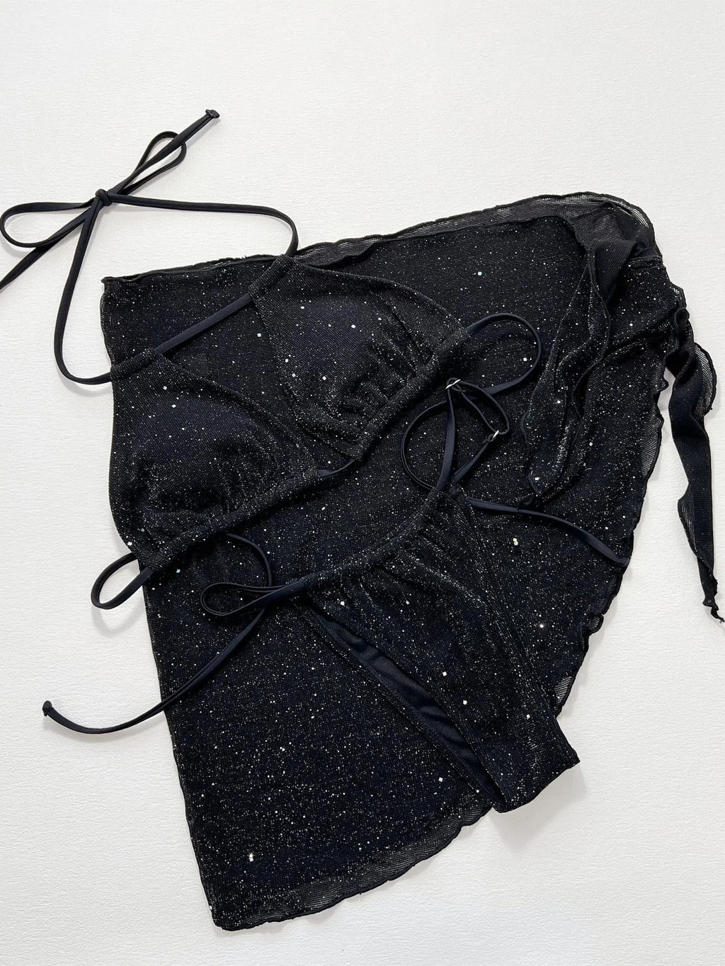Black three-piece bikini swimsuit set with top and shorts on a mannequin.