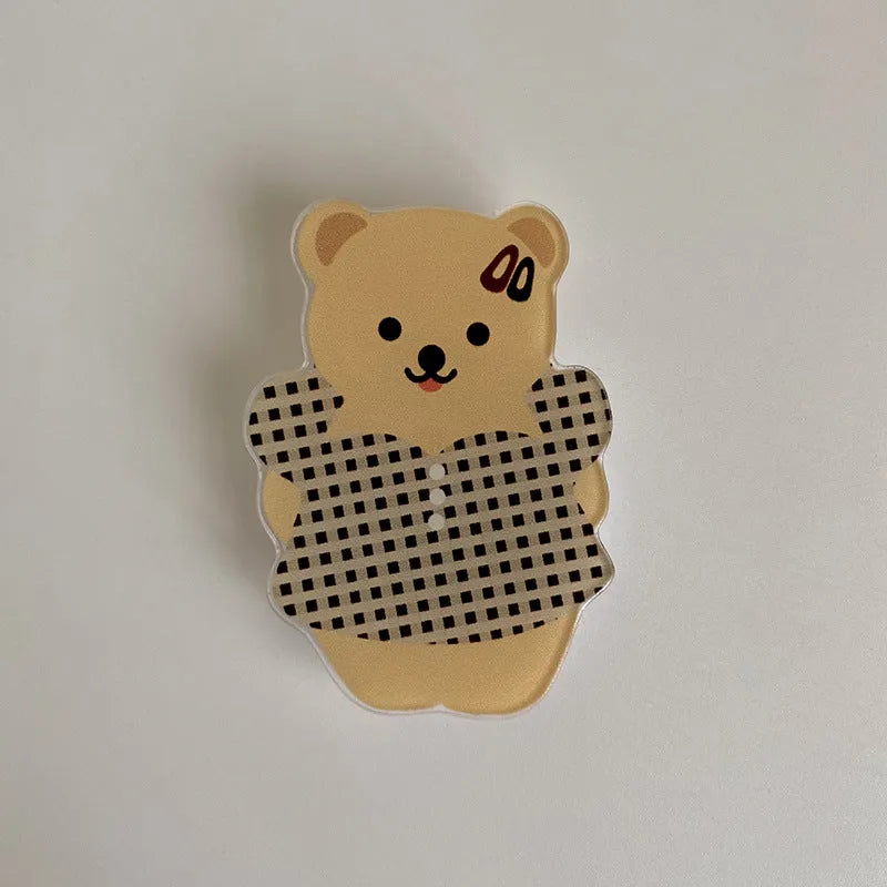 White epoxy resin Brown Bear series phone bracket with bear holding flower design on desk