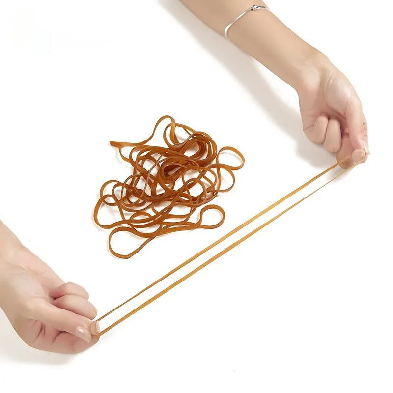 Natural colour rubber rings in a round shape, supplied in a 500g bag for bundling and securing.