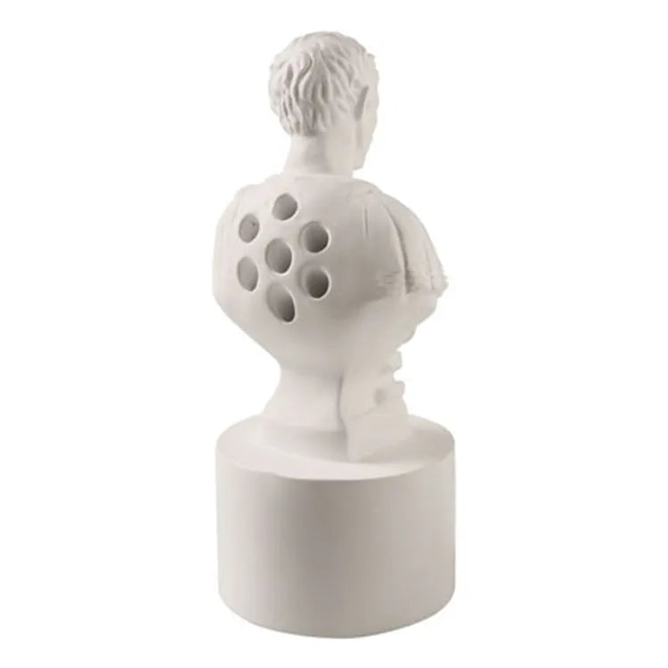 White synthetic resin American creative character model used as a desk pen holder.