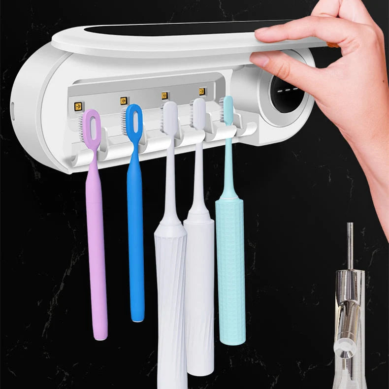 Wall-mounted toothbrush holder with UV sterilizer and toothpaste dispenser in ivory white