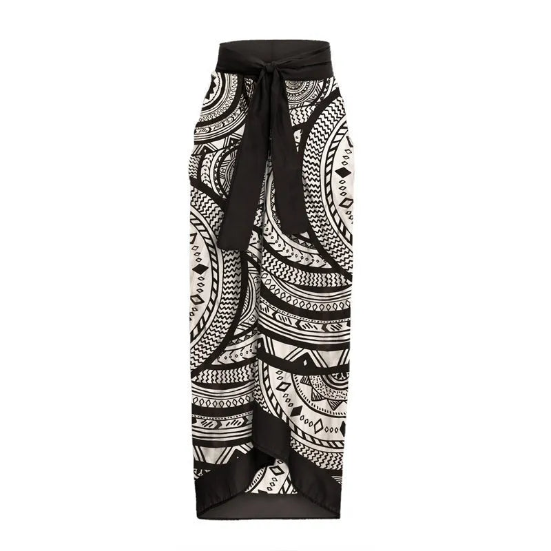 Women's vintage print deep V ruffled one-piece swimsuit with matching wrap skirt.