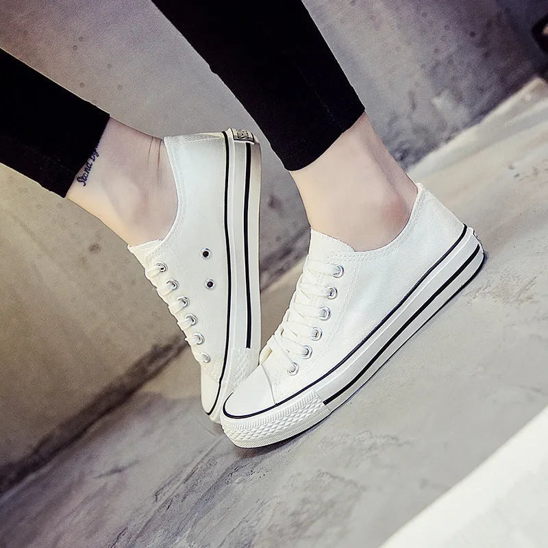 Women's solid colour casual canvas shoes shown in black, white black, white red, and all black options.