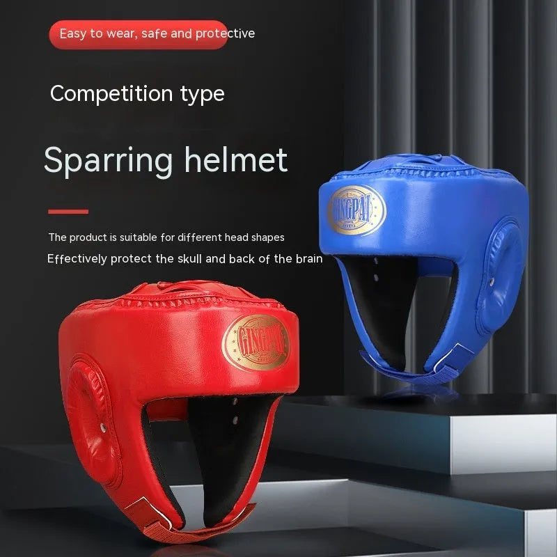 Fully enclosed red boxing helmet with jaw protection on a grey background.