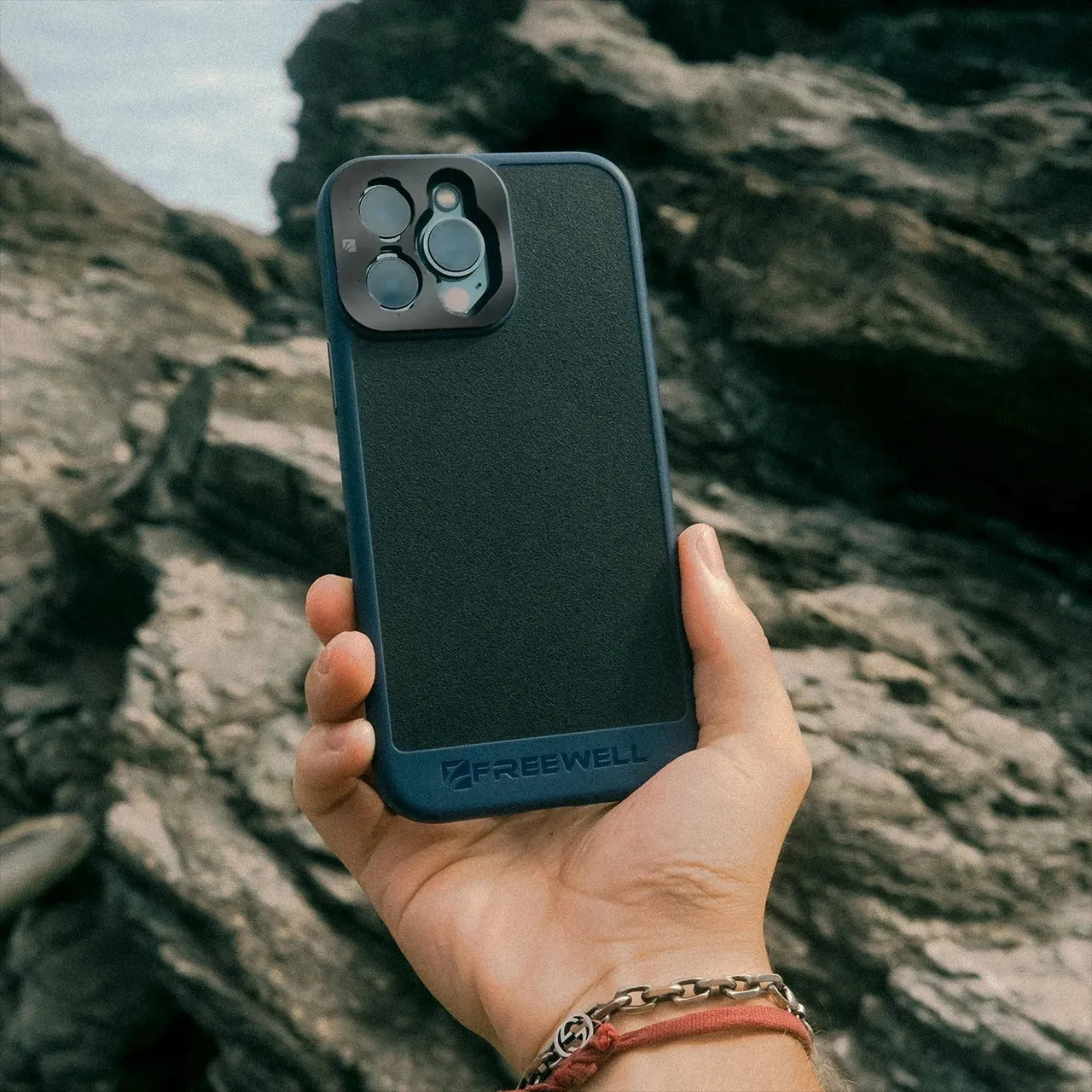 Black protective phone case compatible with iPhone 13 Pro, 14 Pro, and 15 Pro models.