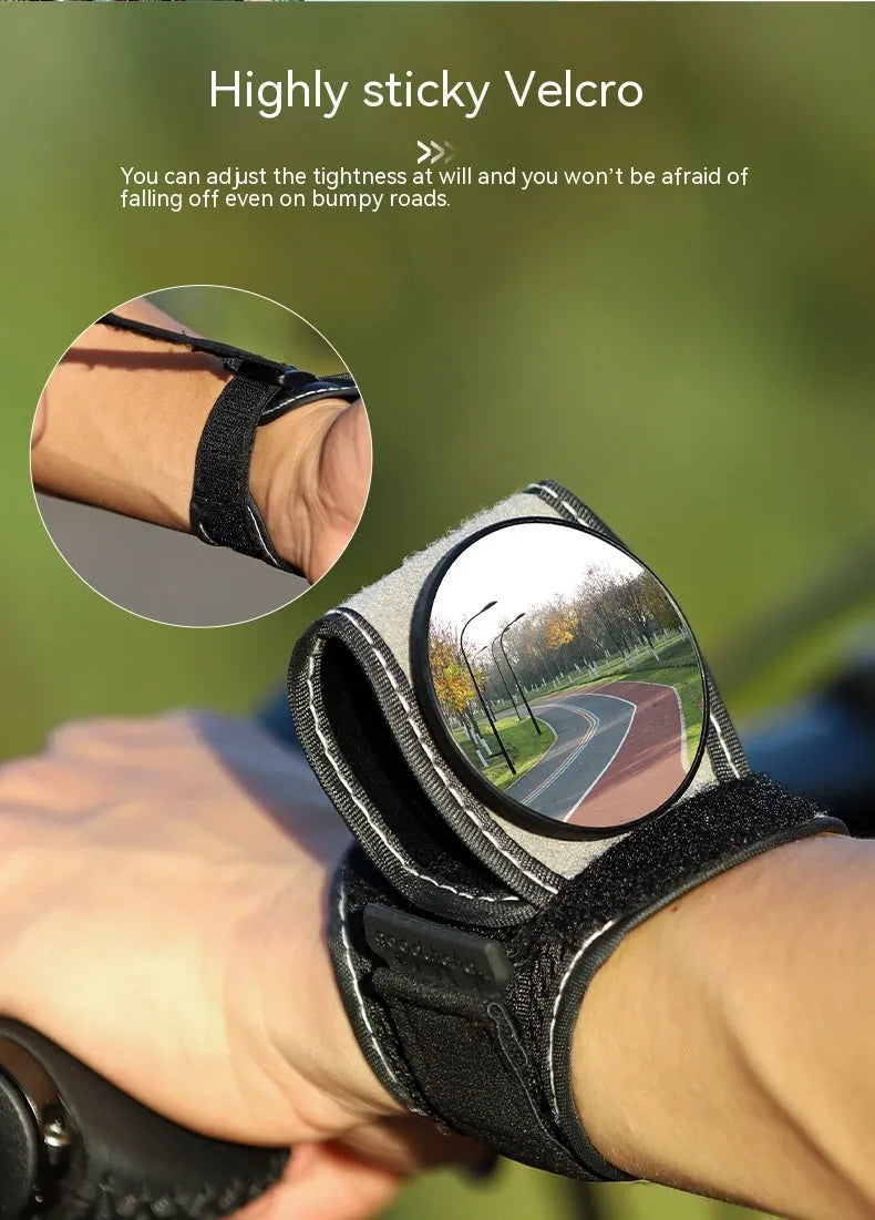 Black nylon bicycle rear-view mirror showing wrist mounting and adjustable viewing mechanism