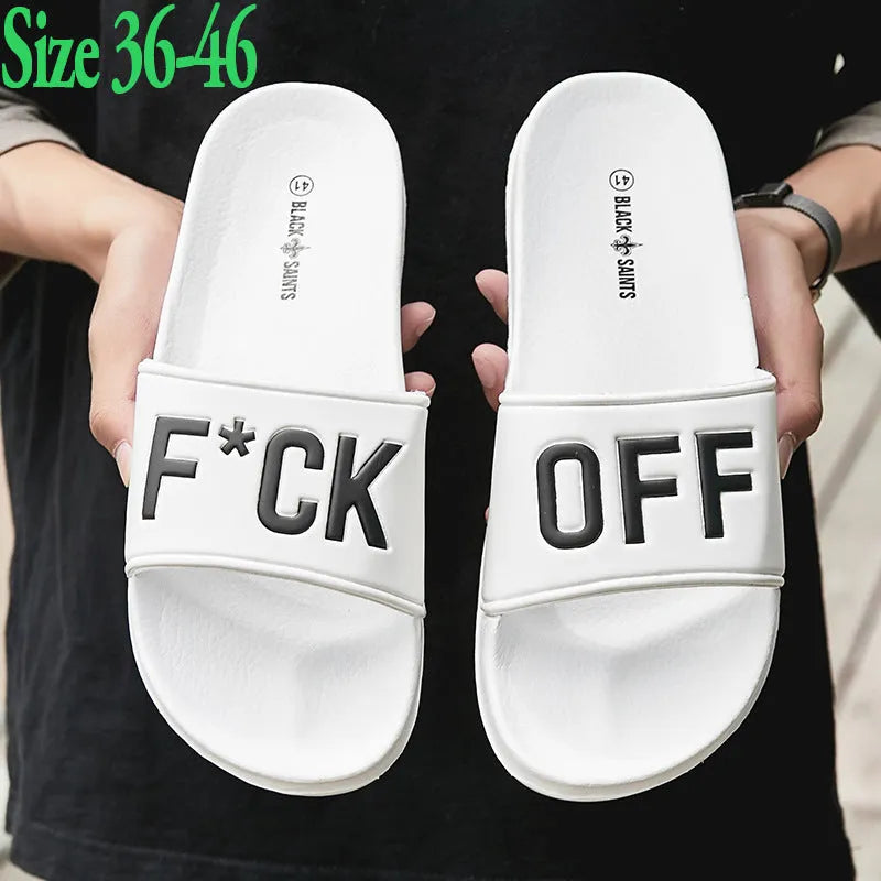 A pair of large men's open-toe slippers with a rubber sole, shown in black.