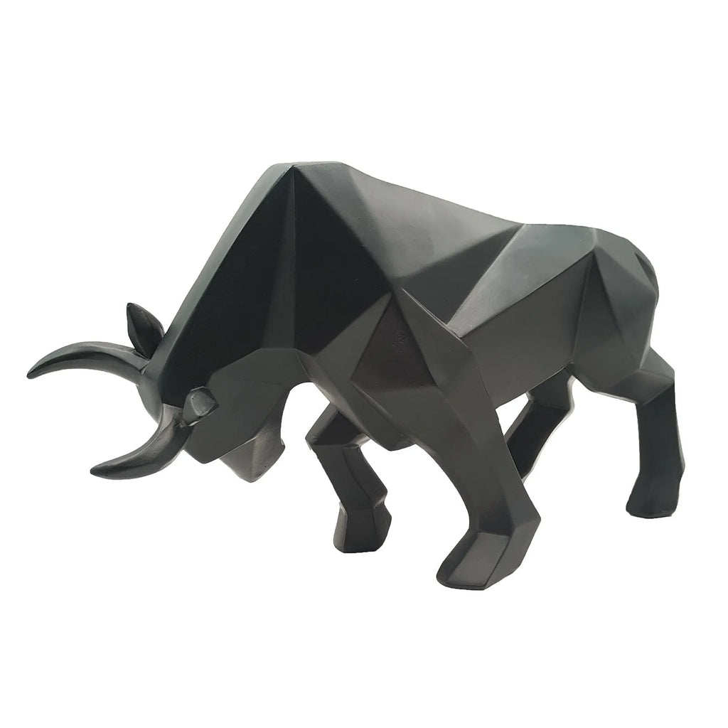 Modern geometric resin bull sculpture in black with abstract angular design on a neutral background