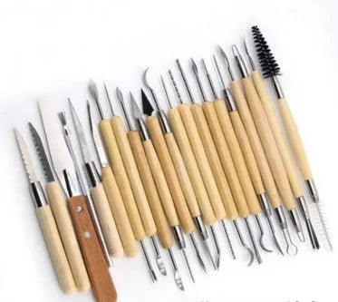 27-piece pottery clay tool set with rolling pin on a table