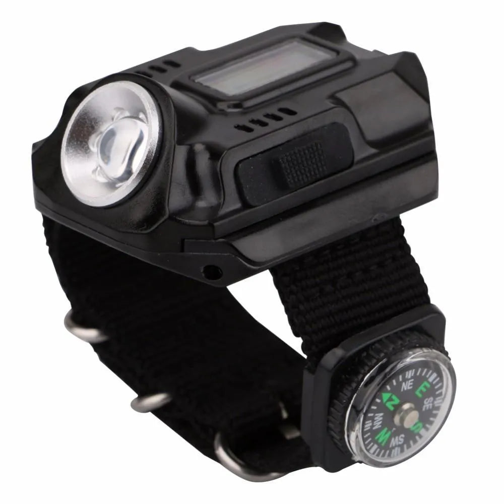 Black LED watch flashlight with time display and compass on wristband for outdoor use