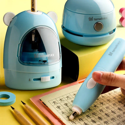 Electric pencil sharpener, eraser, and table vacuum cleaner set in blue