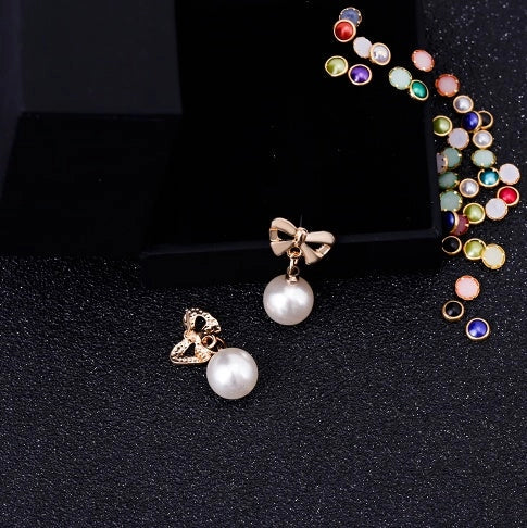 Hypoallergenic heart-shaped zircon and bow pearl earrings for women, ideal for sensitive ears.