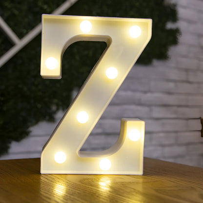 White plastic LED alphabet marquee sign with warm white illumination, 22cm height with battery operation